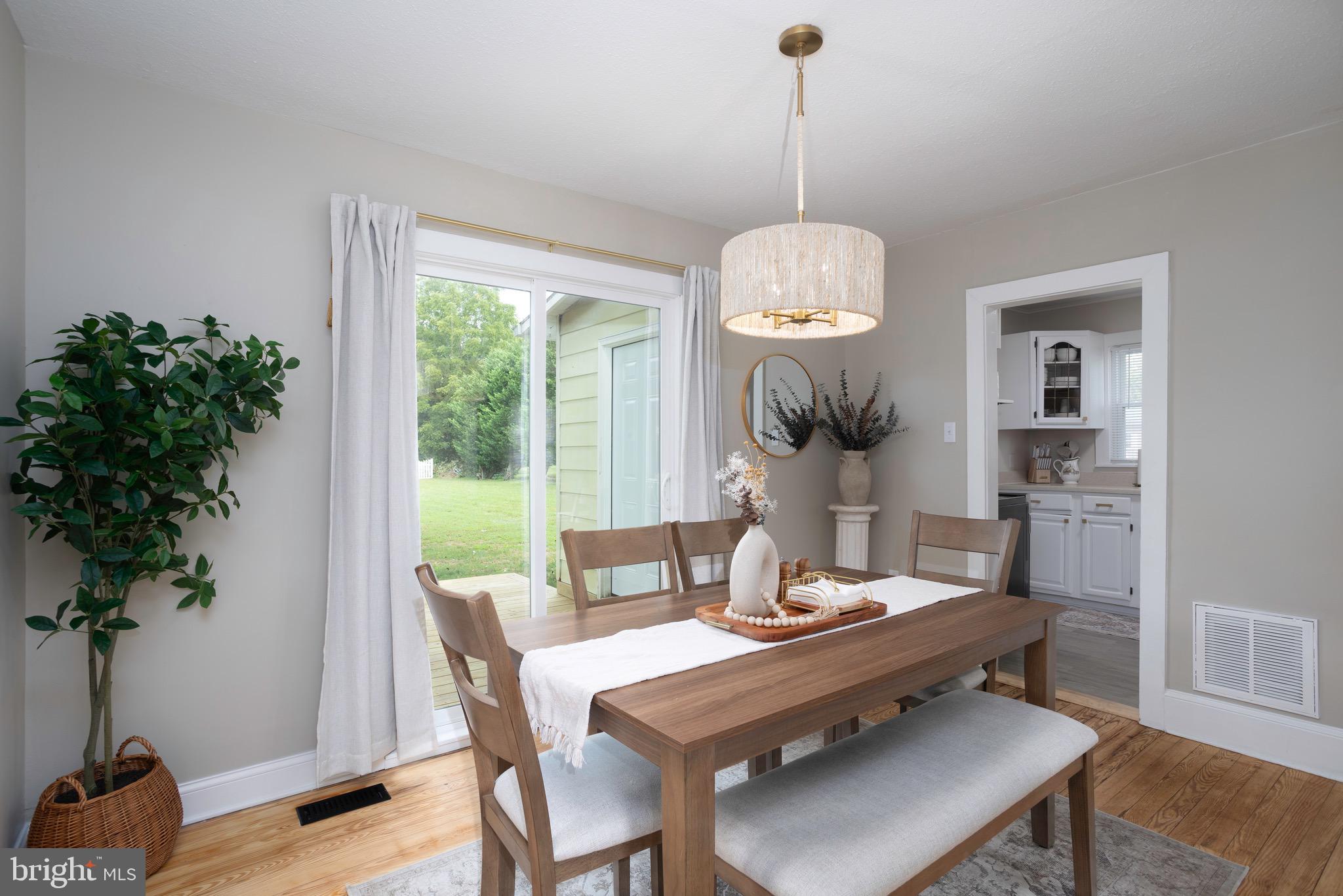529 North 6th Street Denton, MD 21629 - Photo 7 of 21 a view of a dining room with furniture window and wooden floor