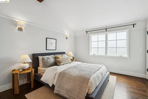 a bedroom with a large bed and a window