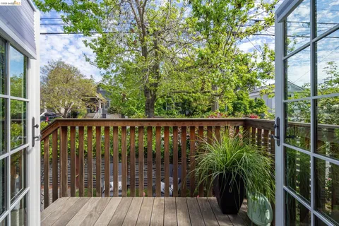 a view of balcony with wooden floor