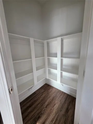 a view of an empty walk in closet
