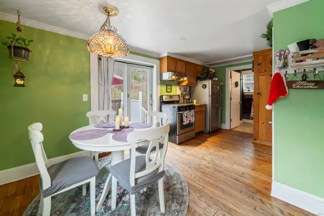 a view of a dining room with furniture window and outside view