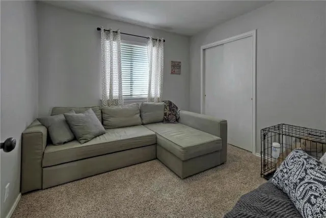 a living room with furniture and window
