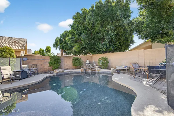 a view of a swimming pool with chairs