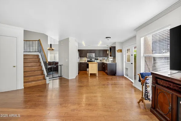 a view of kitchen with furniture and wooden floor