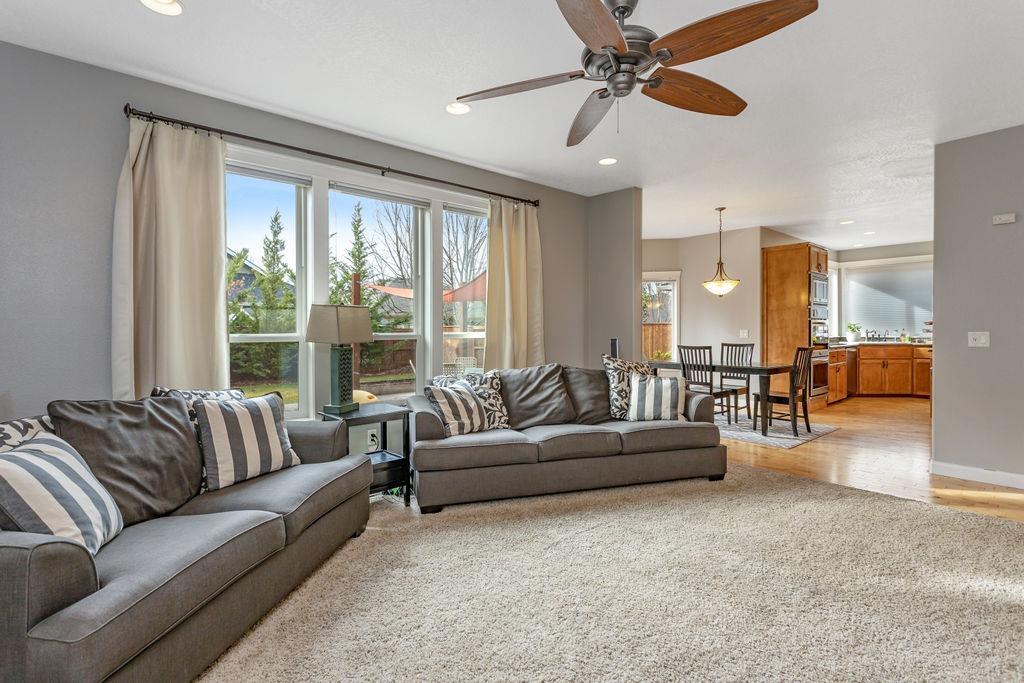 1042 Pumpkin Ridge Eagle Point, OR 97524 - Photo 13 of 34 a living room with furniture and a large window