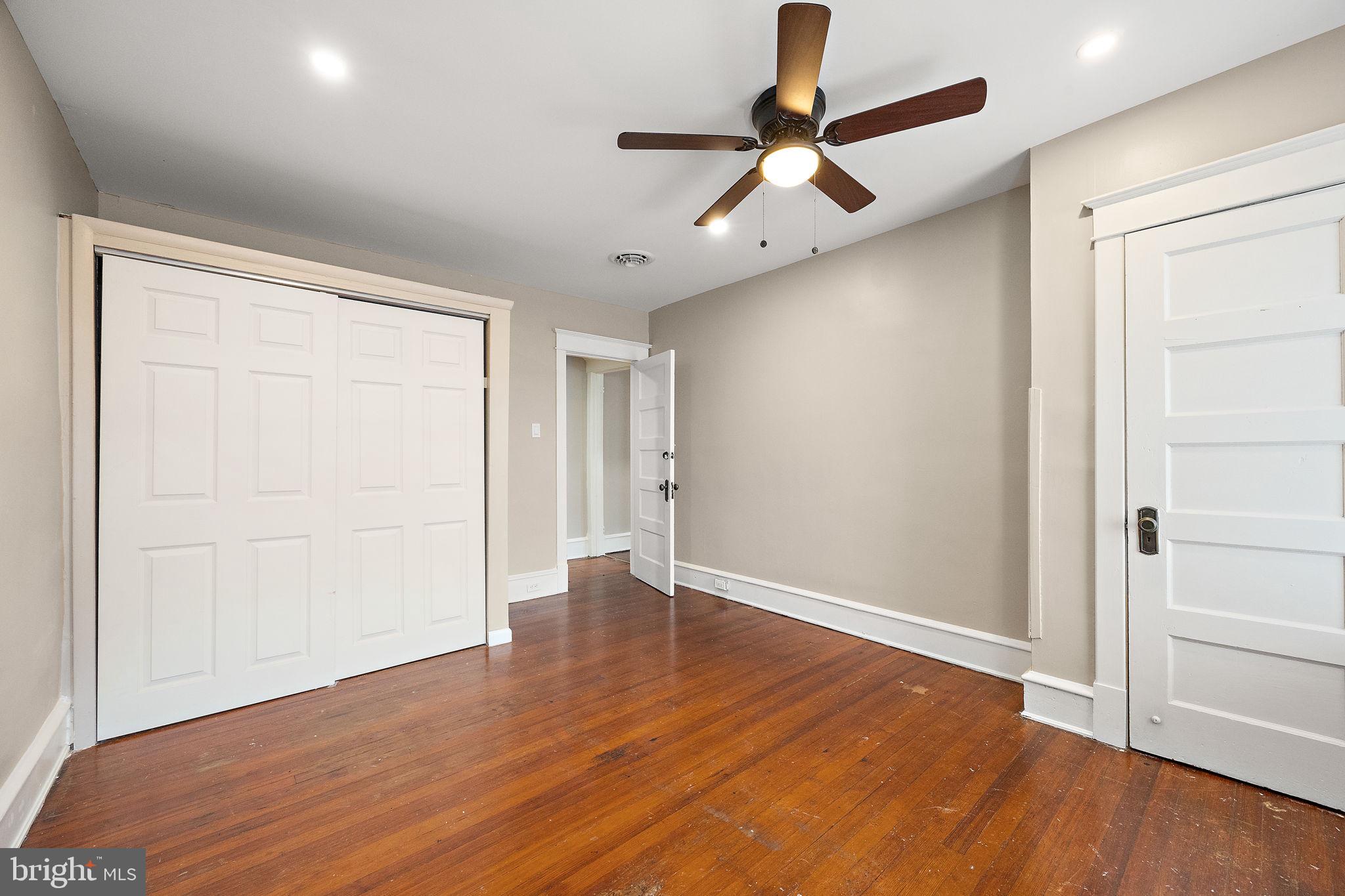 1522 West 7th Street, Unit 3 Wilmington, DE 19805 - Photo 4 of 13 wooden floor in an empty room with a window