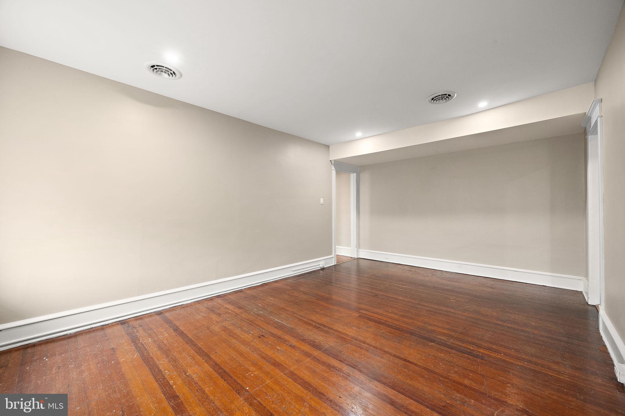 1522 West 7th Street, Unit 3 Wilmington, DE 19805 - Photo 6 of 13 a view of an empty room with wooden floor