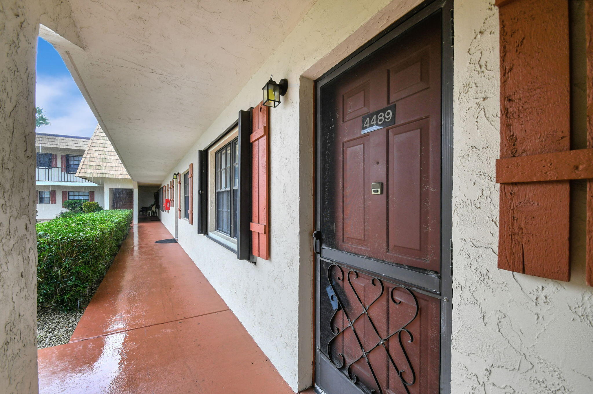 4489 Oak Terrace Drive Greenacres, FL 33463 - Photo 4 of 33 Covered walkway