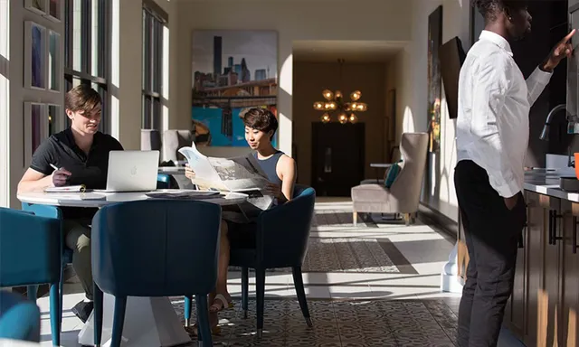 a view of living room kitchen with furniture and fireplace