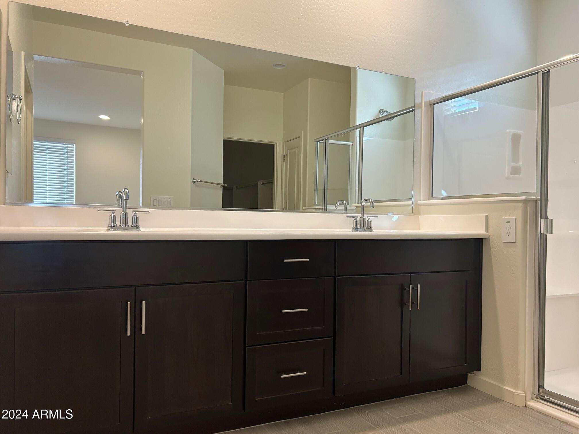20520 North Candlelight Road Maricopa, AZ 85138 - Photo 14 of 18 a bathroom with a double vanity sink and a mirror