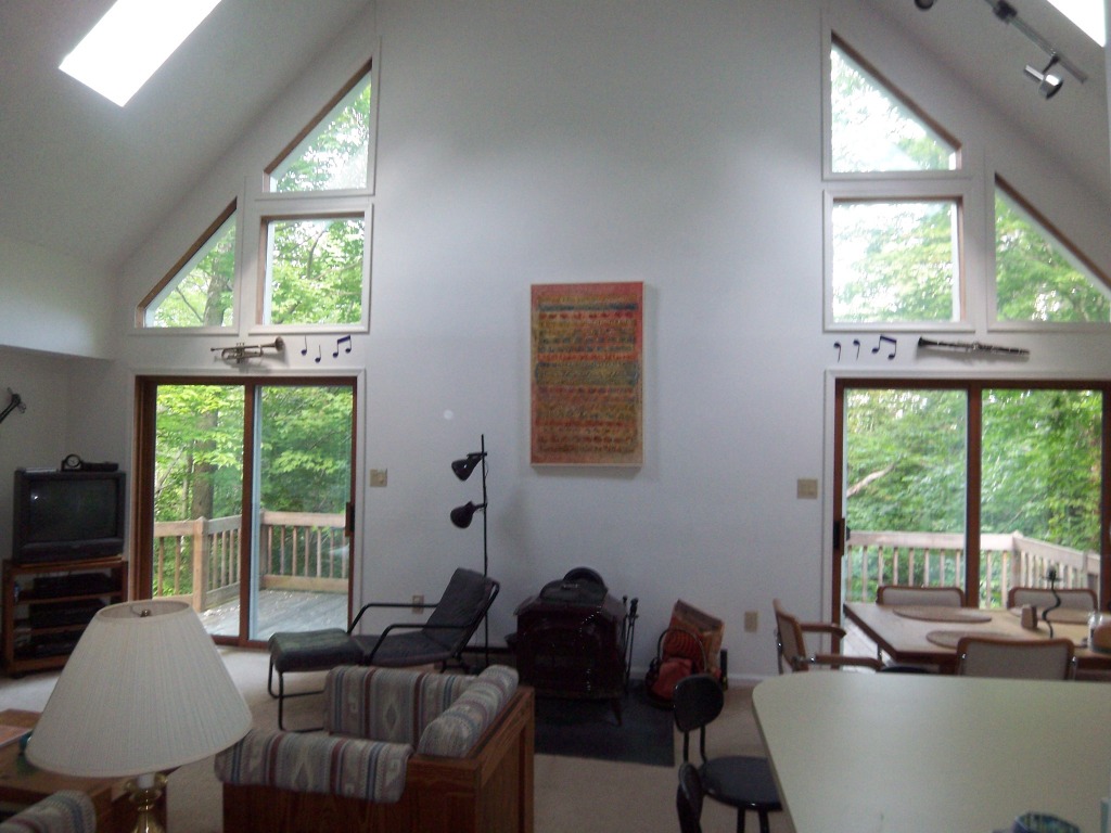 564 Leonhardt Road Becket, MA 01223 - Photo 2 of 11 a living room with furniture and a window