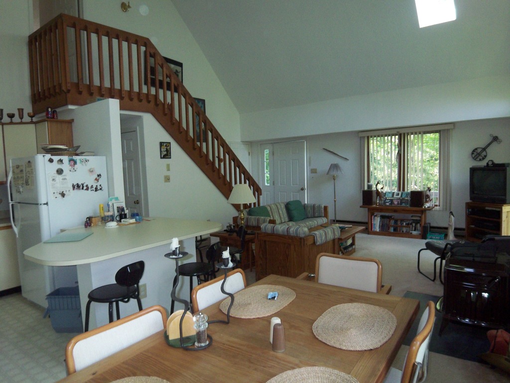 564 Leonhardt Road Becket, MA 01223 - Photo 4 of 11 a living room with furniture and a table