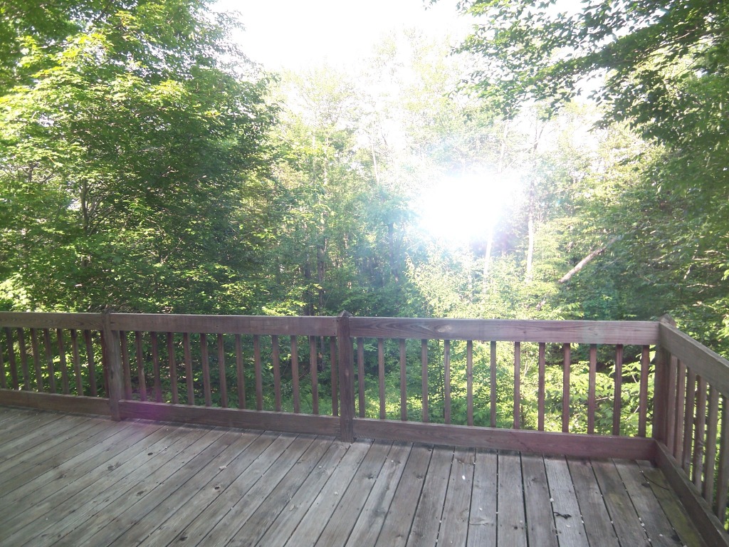 564 Leonhardt Road Becket, MA 01223 - Photo 8 of 11 a view of a balcony with wooden floor