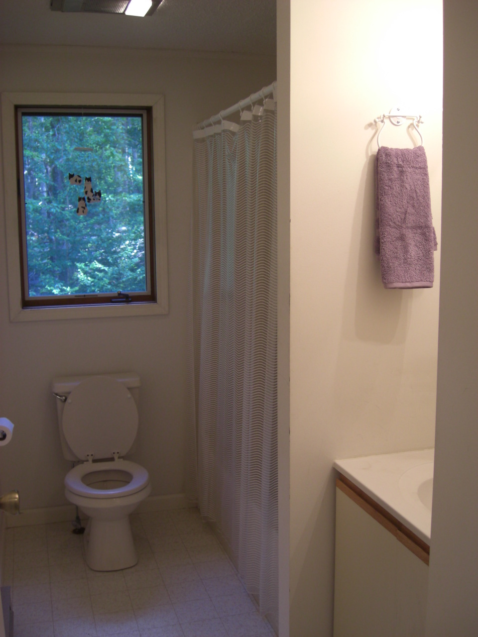 564 Leonhardt Road Becket, MA 01223 - Photo 9 of 11 a white toilet sitting next to a small bathroom
