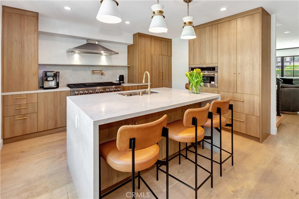 418 East 16th Street Costa Mesa, CA 92627 - Photo 12 of 28 a kitchen with stainless steel appliances a sink stove and refrigerator