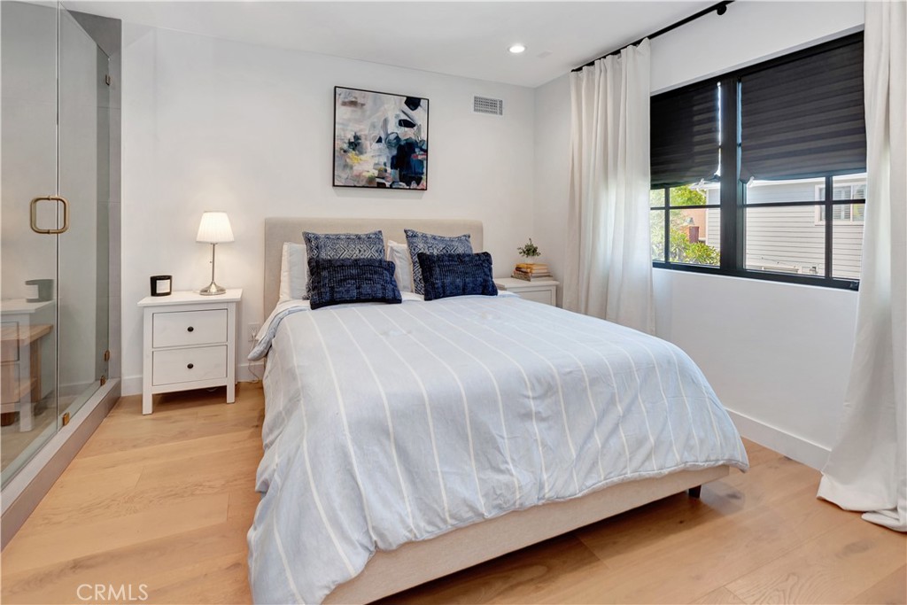 418 East 16th Street Costa Mesa, CA 92627 - Photo 16 of 28 a bedroom with a bed and a window