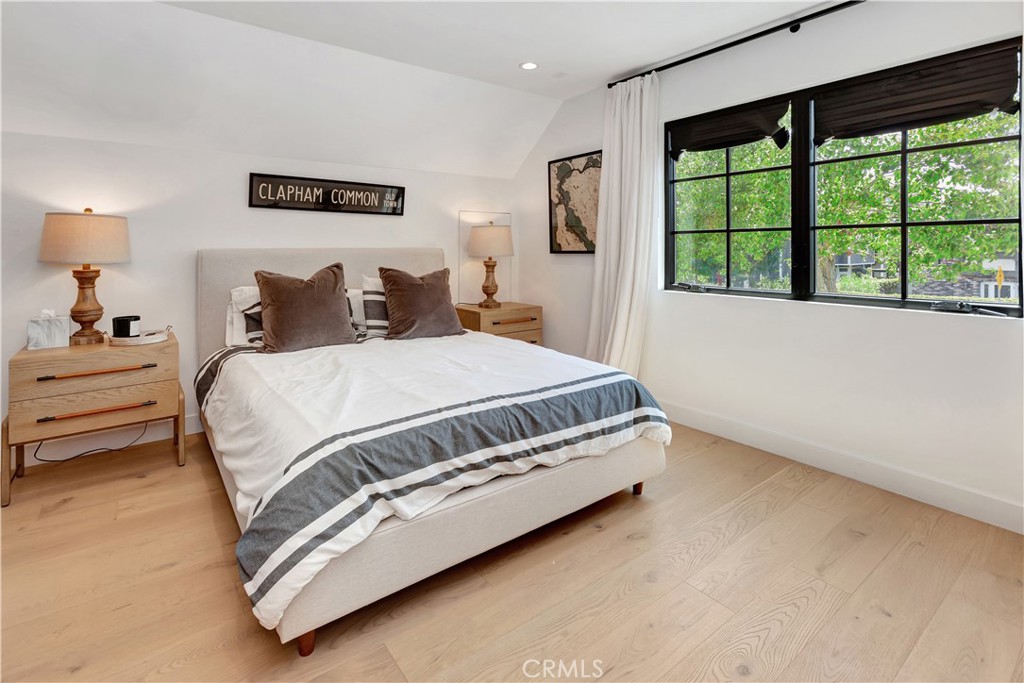 418 East 16th Street Costa Mesa, CA 92627 - Photo 18 of 28 a bedroom with a bed next to a large window