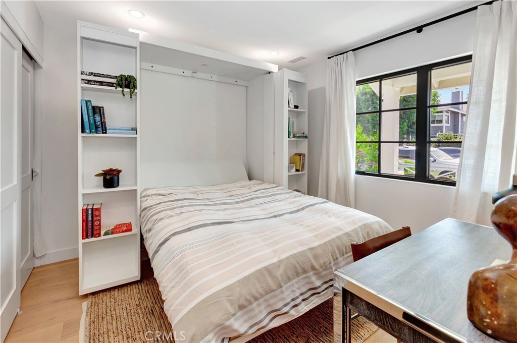 418 East 16th Street Costa Mesa, CA 92627 - Photo 22 of 28 a bedroom with a bed and a window