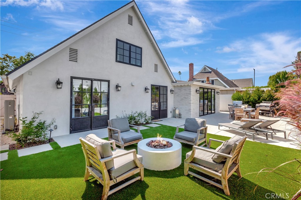 418 East 16th Street Costa Mesa, CA 92627 - Photo 26 of 28 a front view of house with yard and outdoor seating