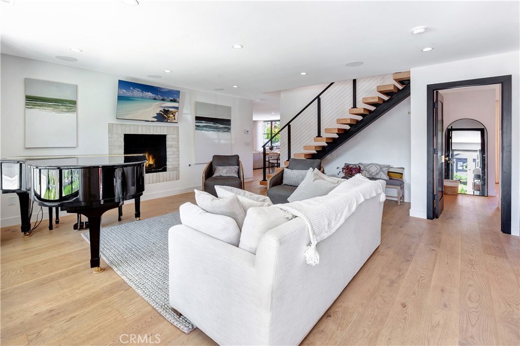 418 East 16th Street Costa Mesa, CA 92627 - Photo 3 of 28 a living room with furniture and a wooden floor