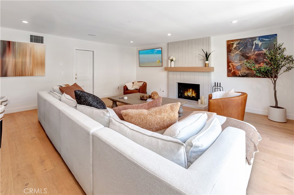 418 East 16th Street Costa Mesa, CA 92627 - Photo 4 of 28 a living room with furniture and a fireplace