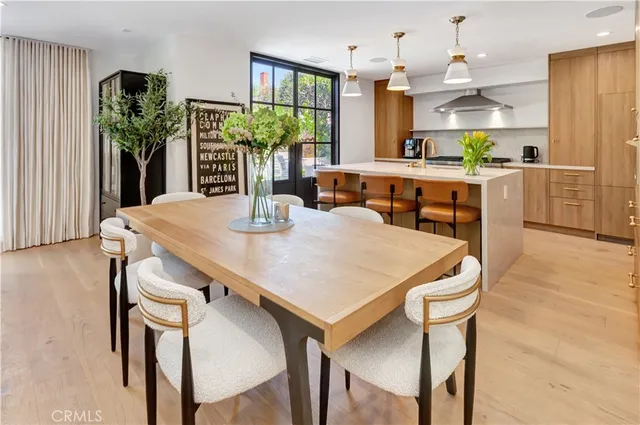 a view of a dining room with furniture and window