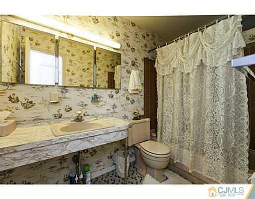 1 Timber Road Edison, NJ 08820 - Photo 15 of 22 a bathroom with a granite countertop sink toilet and shower