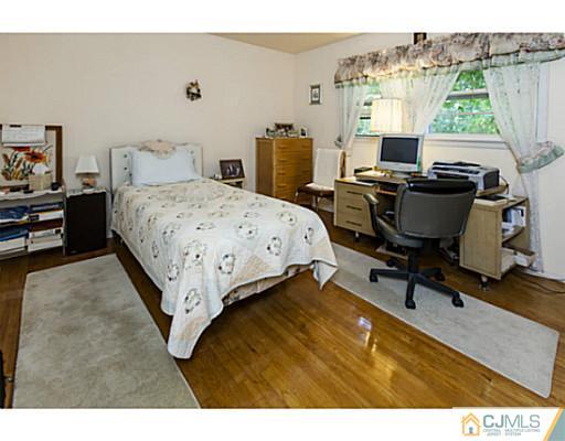 1 Timber Road Edison, NJ 08820 - Photo 18 of 22 a bedroom with a bed and a desk