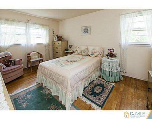 1 Timber Road Edison, NJ 08820 - Photo 19 of 22 a living room with hard wood flooring and furniture