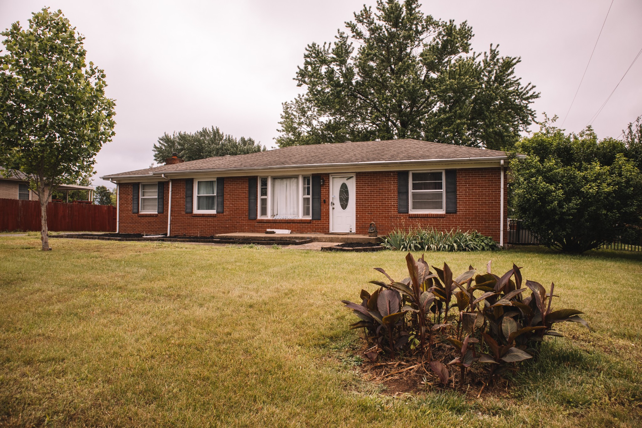 508 Needmore Road Clarksville, TN 37040 - Photo 2 of 2 a front view of a house with a yard table and chairs