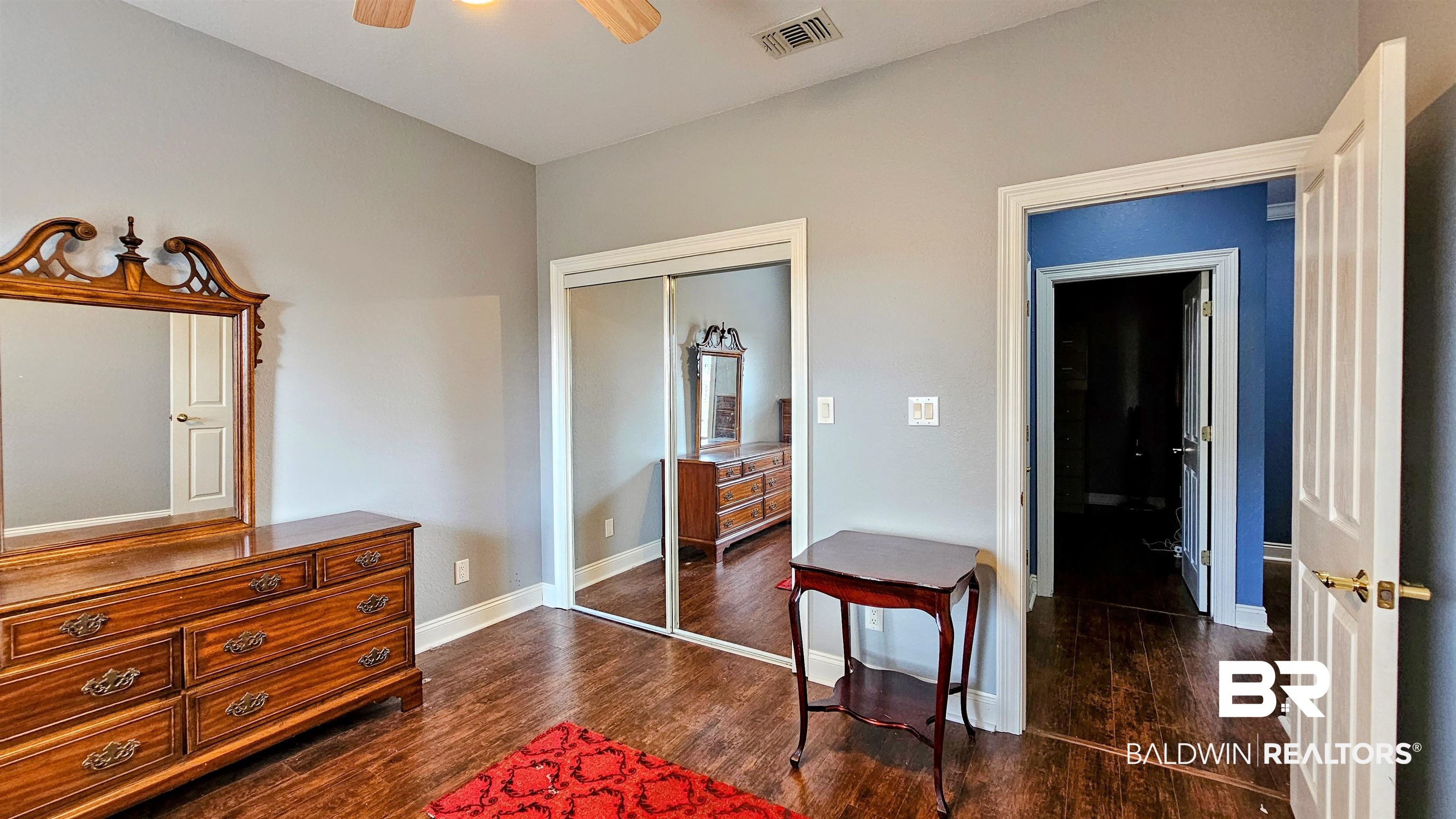 9275 Crawford Road Elberta, AL 36530 - Photo 28 of 28 Bedroom featuring a closet, dark wood-style flooring, and ceiling fan