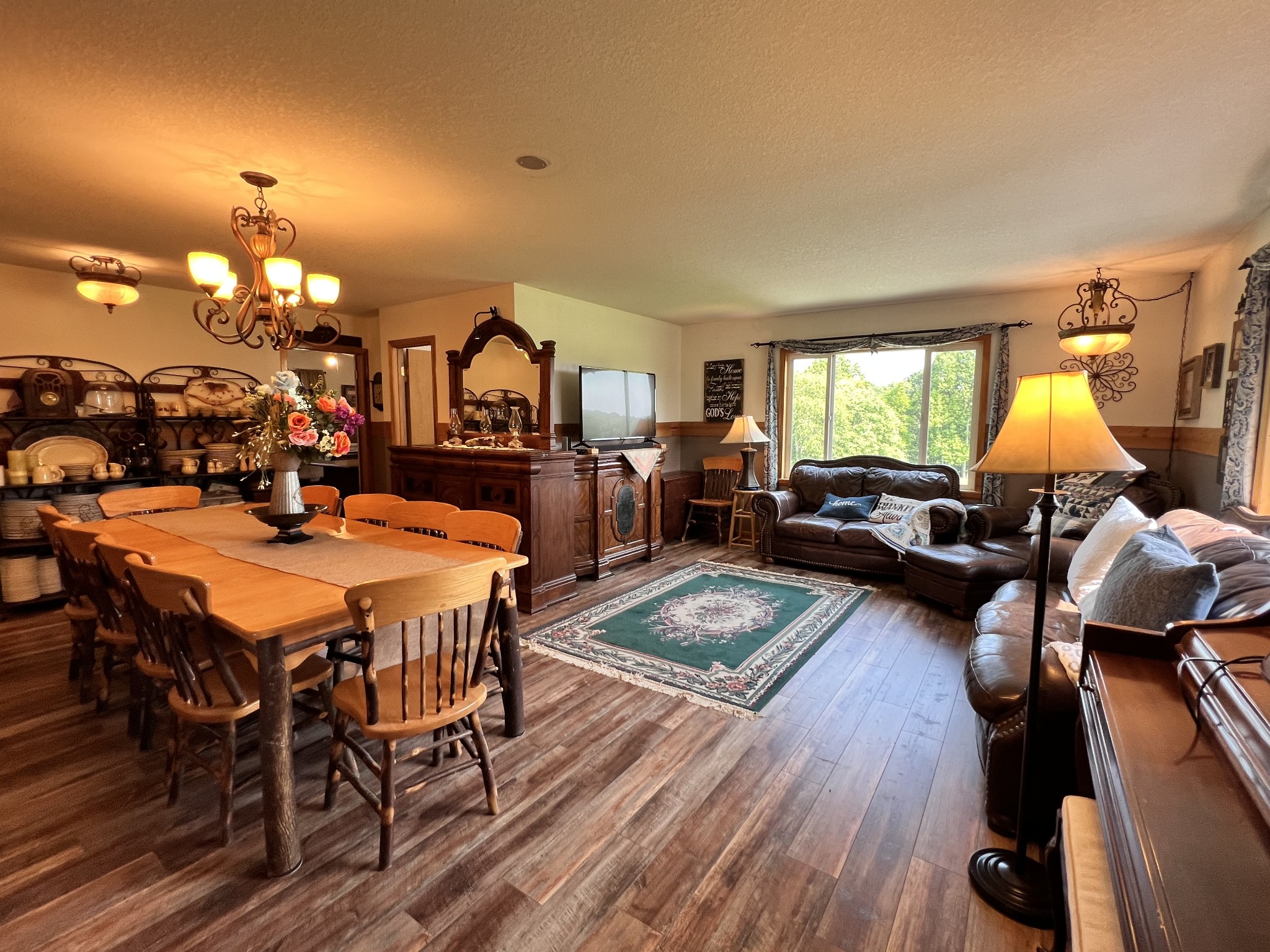 4250 Standing Rock Road Jamestown, TN 38556 - Photo 15 of 70 a view of a dining room with furniture and wooden floor