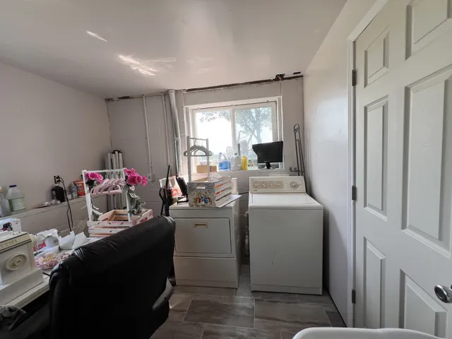 a kitchen with a stove a sink and cabinets