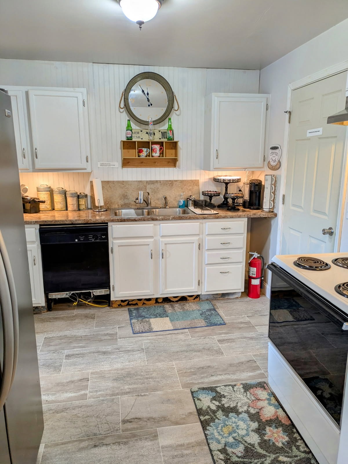 4250 Standing Rock Road Jamestown, TN 38556 - Photo 60 of 70 a kitchen with stainless steel appliances granite countertop a stove and a microwave