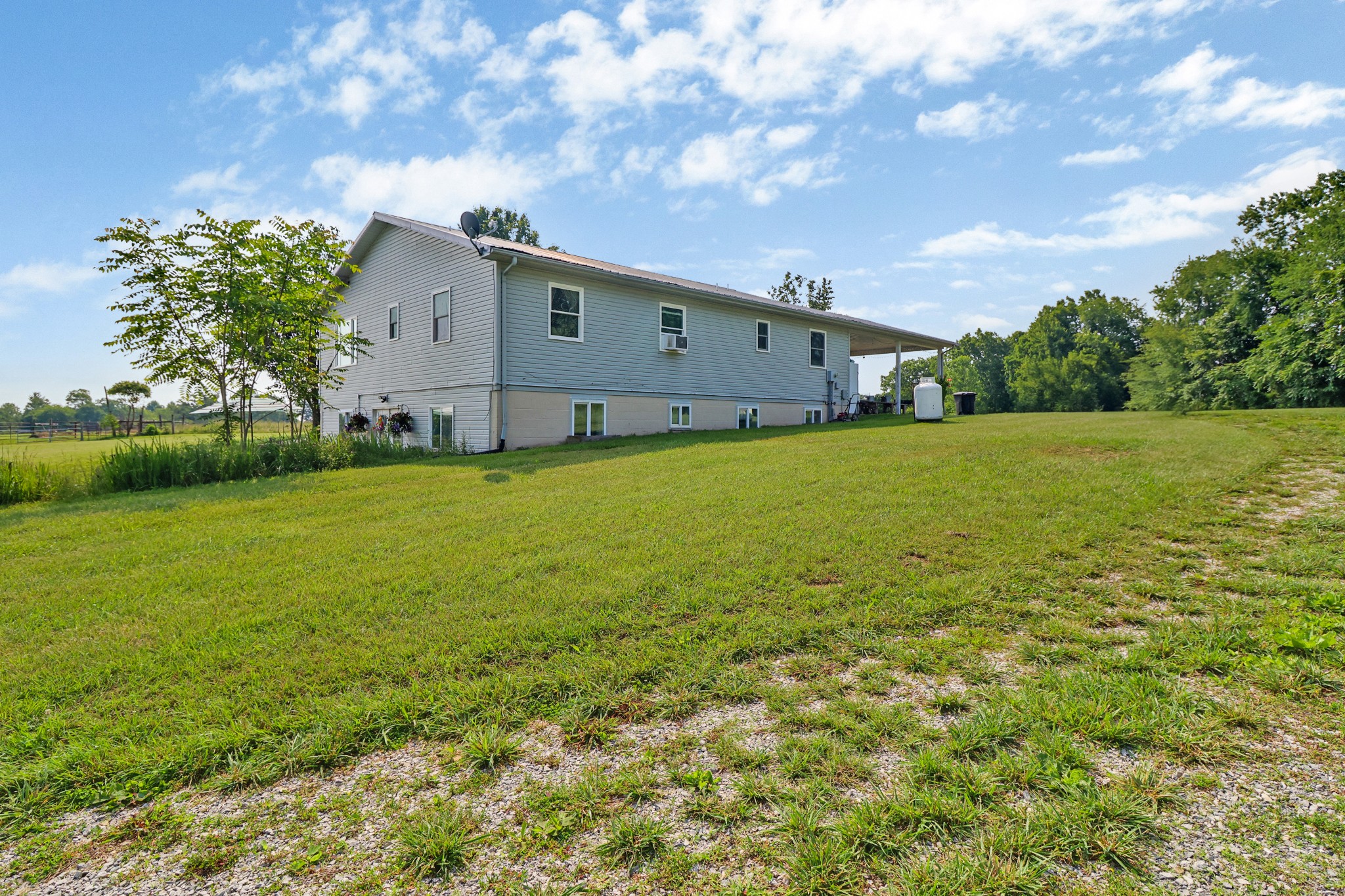 4250 Standing Rock Road Jamestown, TN 38556 - Photo 7 of 70 a backyard of a house with lots of green space