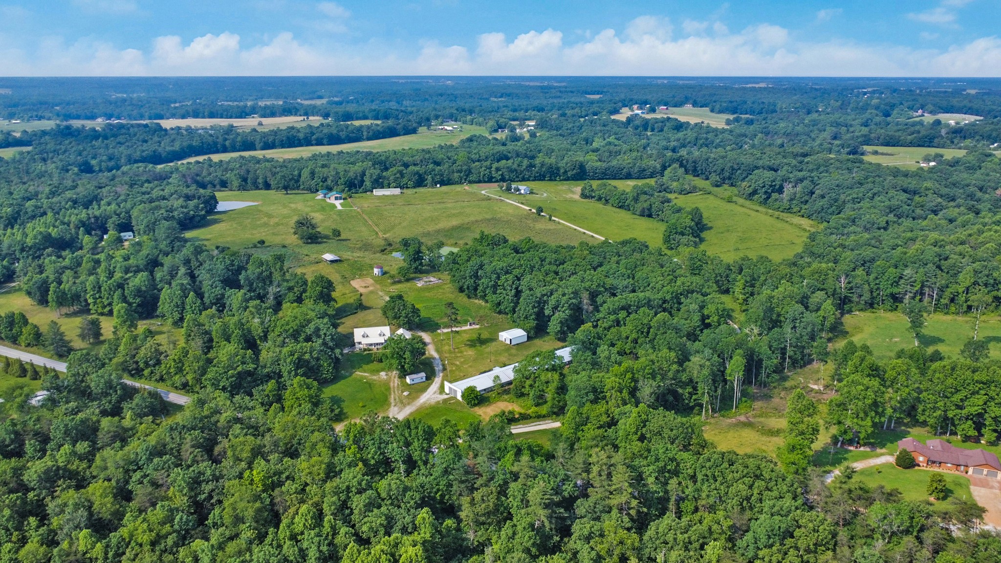 4250 Standing Rock Road Jamestown, TN 38556 - Photo 9 of 70 an aerial view of residential houses with outdoor space and trees all around