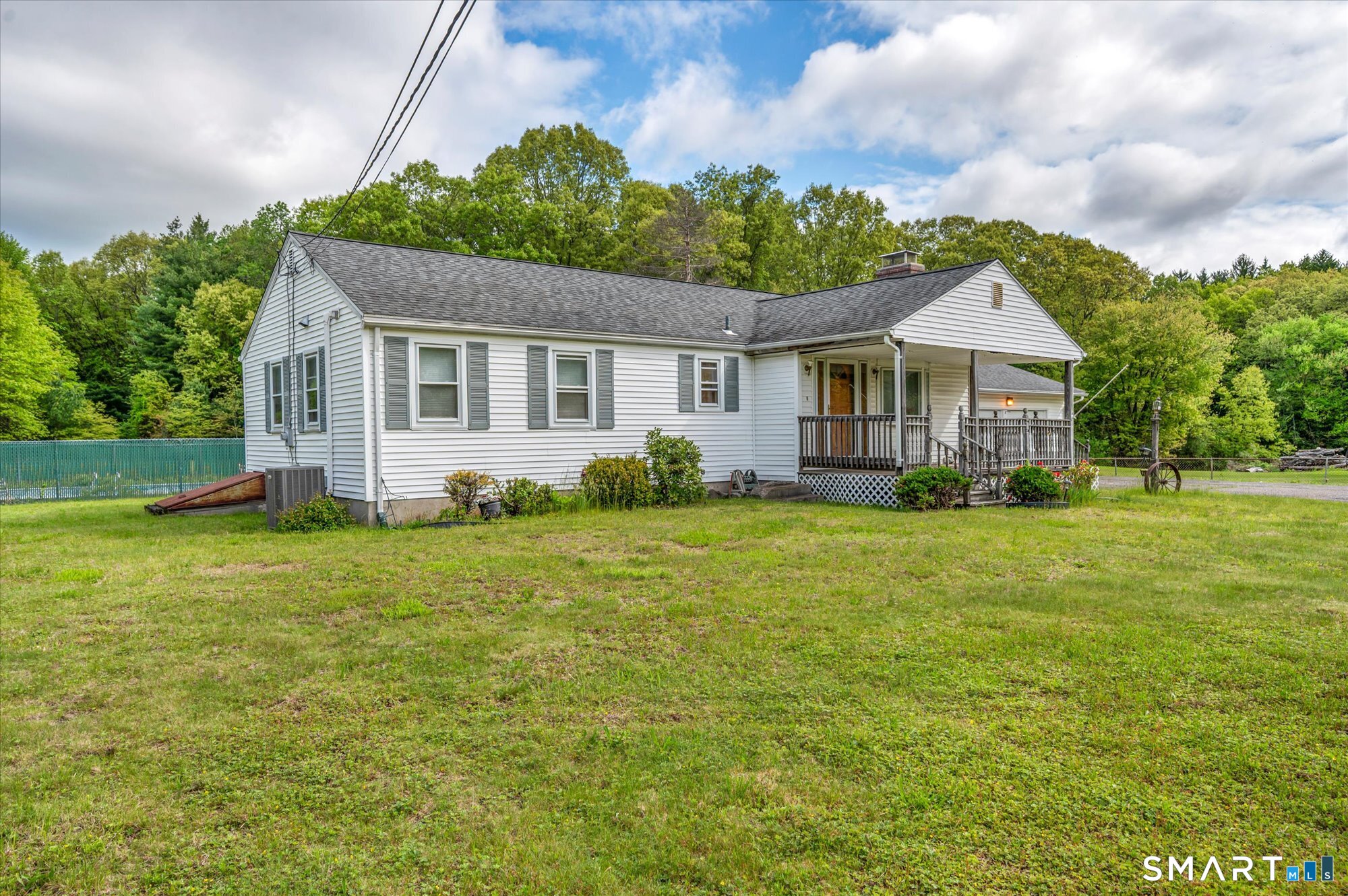 740 Rainbow Road Windsor, CT 06095 - Photo 2 of 40 a front view of house with yard and green space