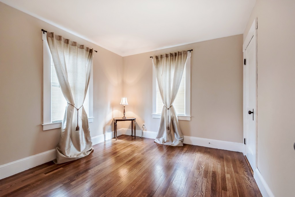 338 Andover Road Billerica, MA 01821 - Photo 14 of 16 a view of empty room with wooden floor and fan