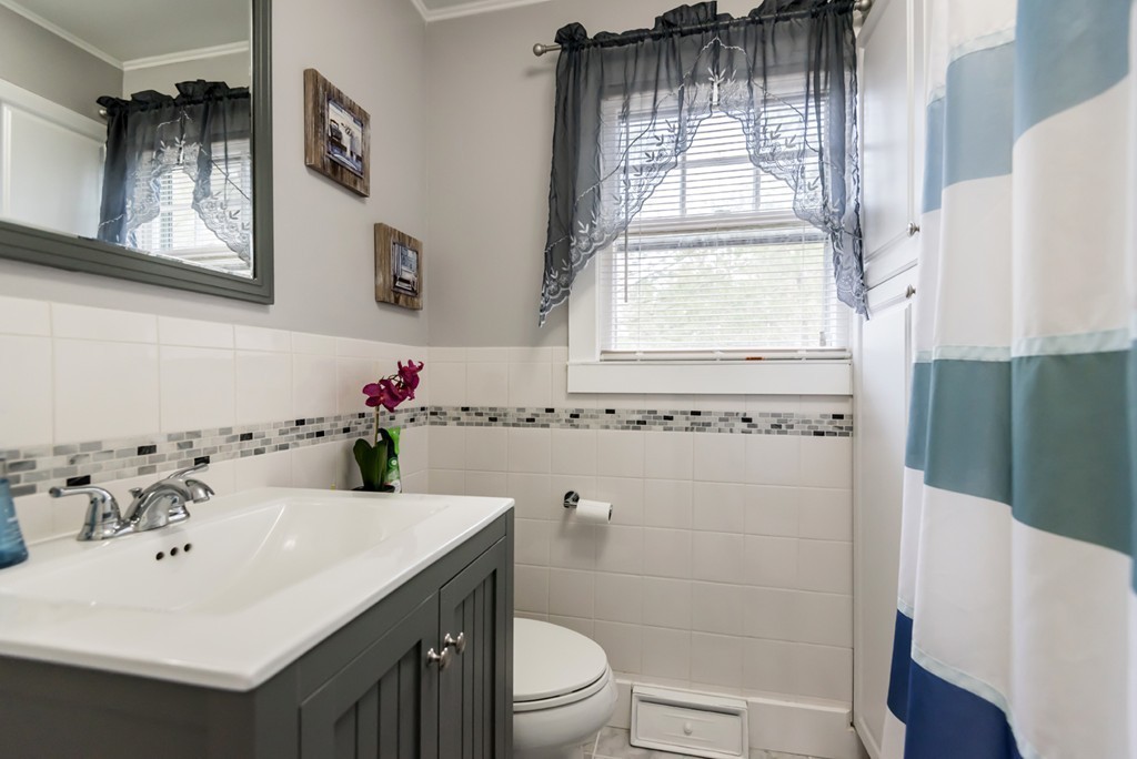 338 Andover Road Billerica, MA 01821 - Photo 15 of 16 a bathroom with a sink a toilet and shower