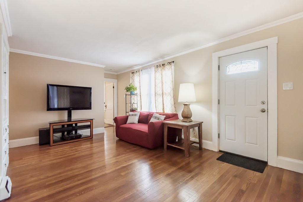 338 Andover Road Billerica, MA 01821 - Photo 8 of 16 a living room with furniture and a flat screen tv