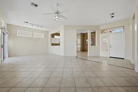 a living room with furniture flat screen tv and a fireplace
