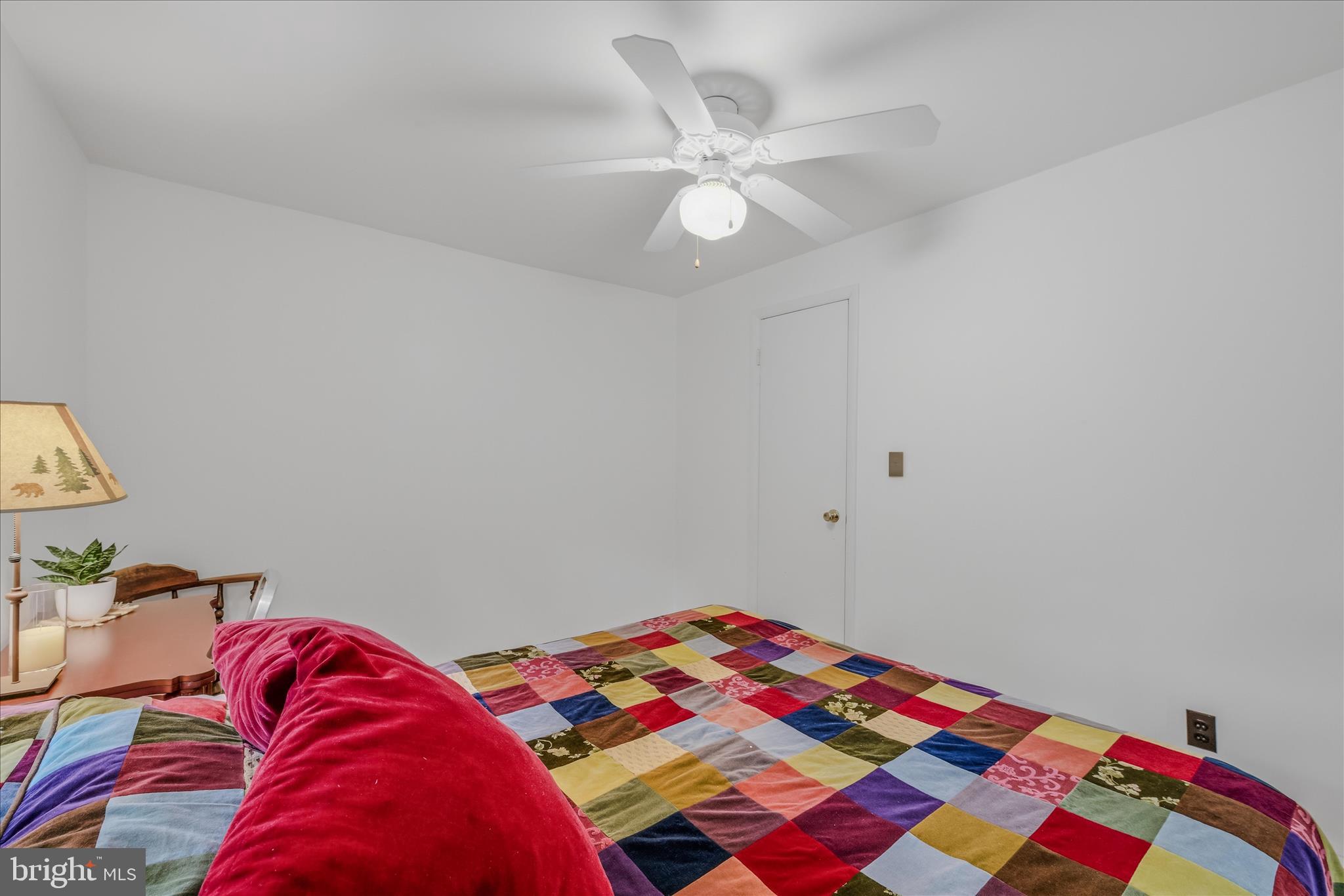 98 Ore Trail Berkeley Springs, WV 25411 - Photo 22 of 46 a bedroom with a bed and a chandelier
