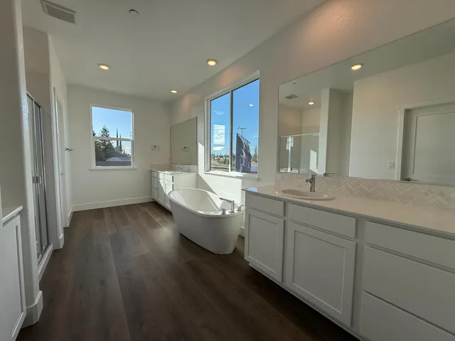 a bathroom with a bathtub and a sink
