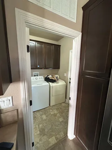 a bathroom with a sink a toilet a mirror and shower