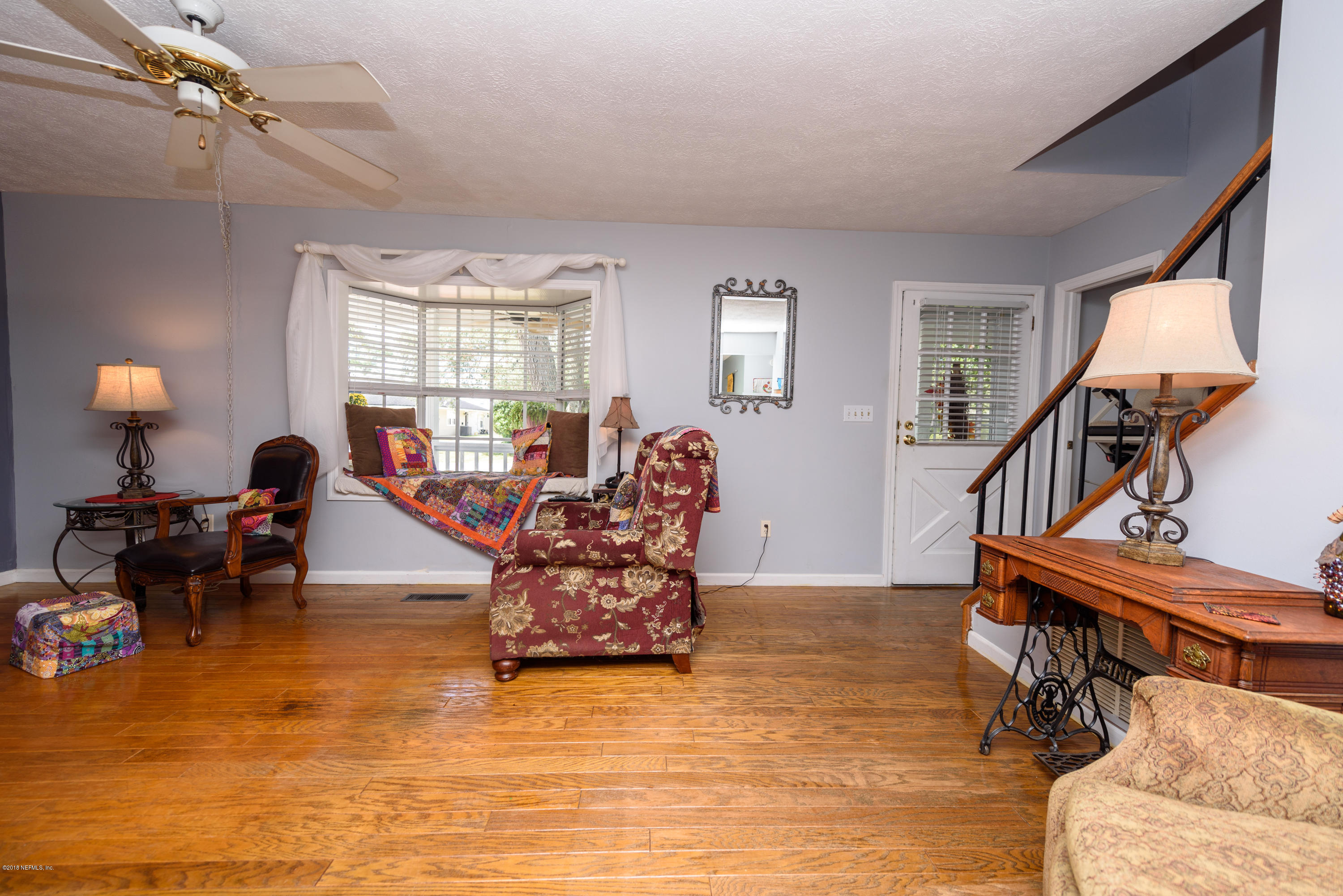 249 Bonita Road St. Augustine, FL 32086 - Photo 11 of 46 a living room with furniture and a wooden floor