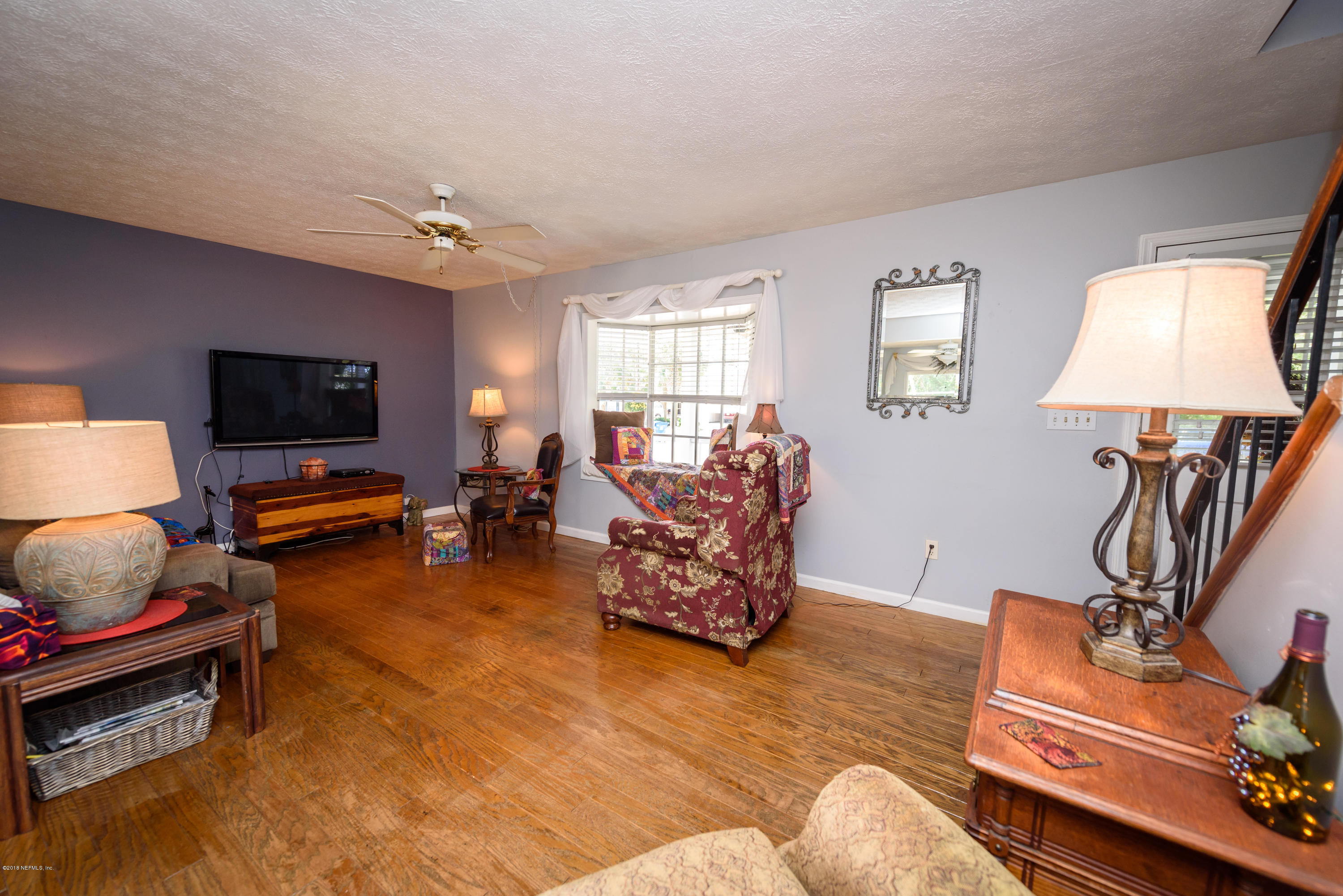 249 Bonita Road St. Augustine, FL 32086 - Photo 12 of 46 a living room with furniture a flat screen tv and a window