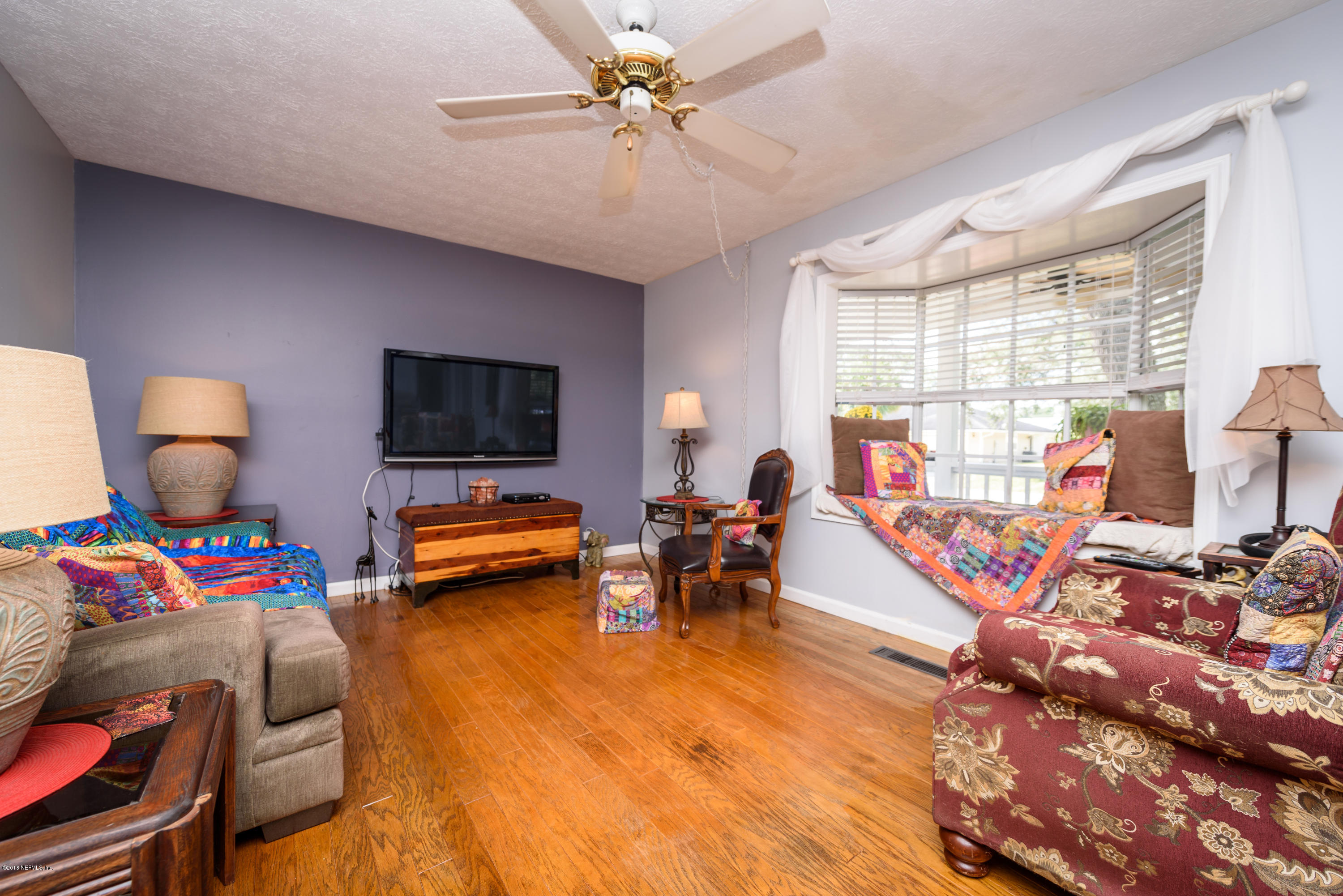 249 Bonita Road St. Augustine, FL 32086 - Photo 13 of 46 a living room with furniture and a flat screen tv