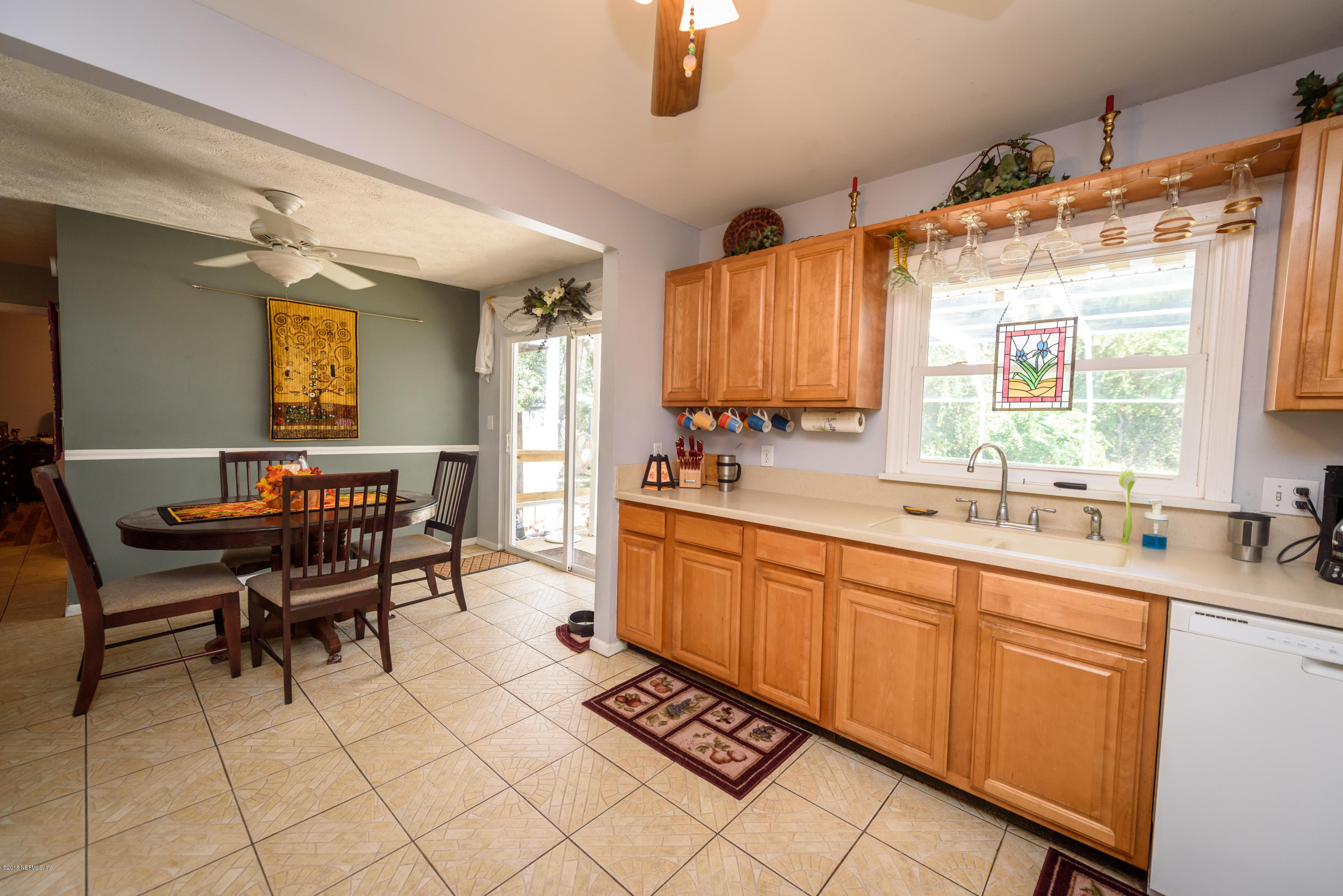 249 Bonita Road St. Augustine, FL 32086 - Photo 19 of 46 a large kitchen with a table and chairs in it