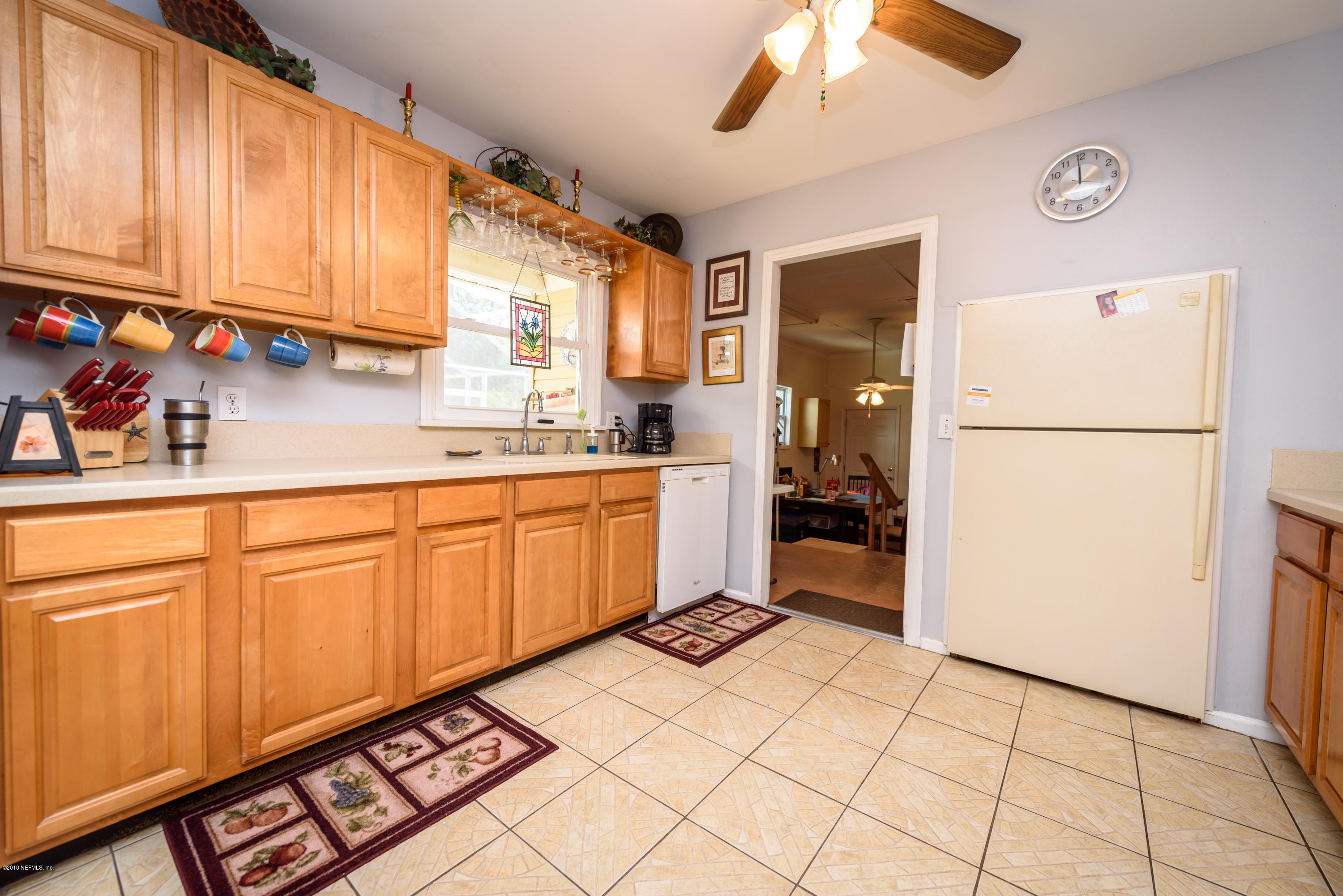 249 Bonita Road St. Augustine, FL 32086 - Photo 20 of 46 a kitchen with a refrigerator a stove top oven and cabinets