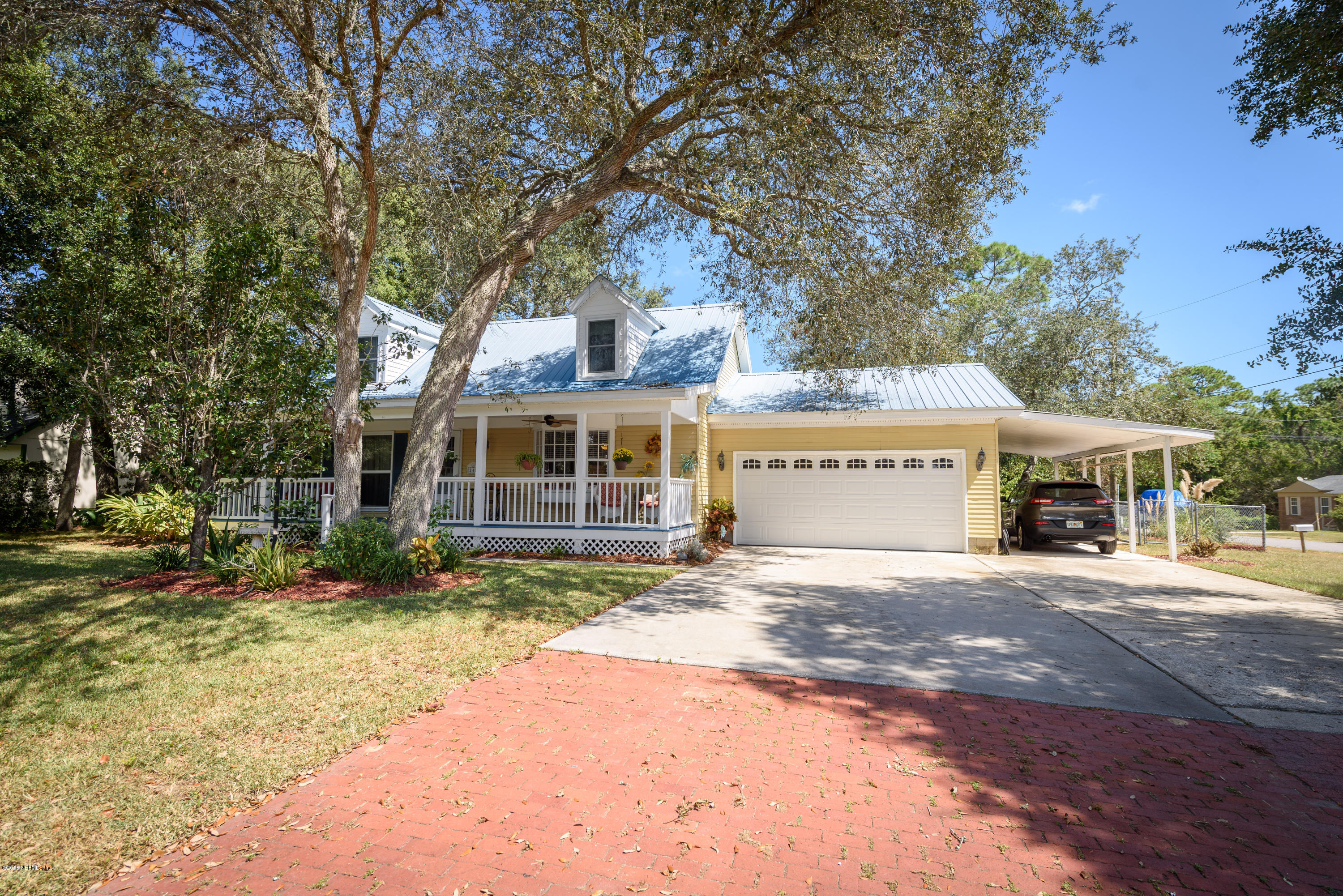 249 Bonita Road St. Augustine, FL 32086 - Photo 2 of 46 a view of a house with a yard and large tree